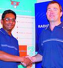RF Design has been appointed as the distributor for Radiometrix in South Africa. Tharan Saba of Radiometrix, UK, congratulates Andrew Hutton of RF Design